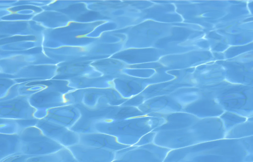 Clear blue pool water with ripples